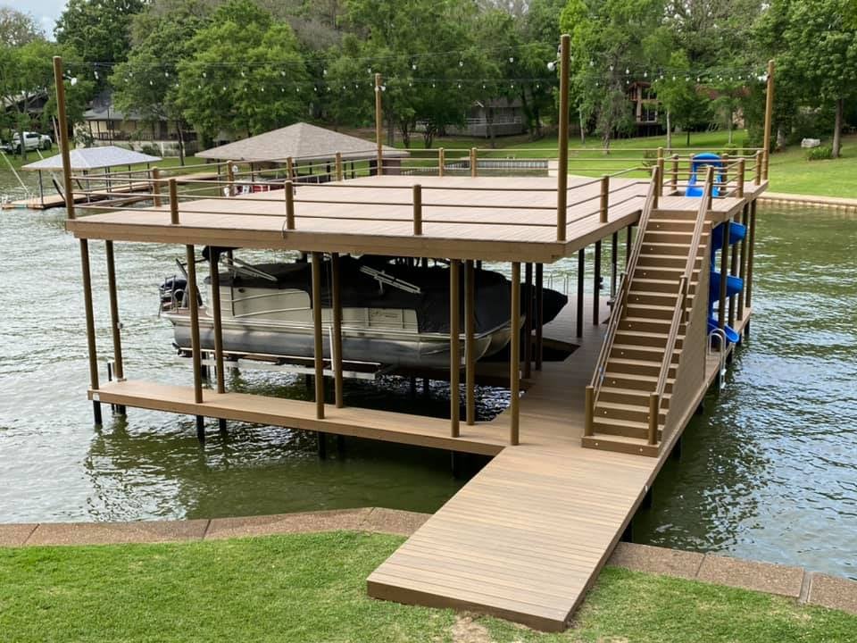Custom Double Dock on the water with a slide, stairs and accent lighting and flood lights